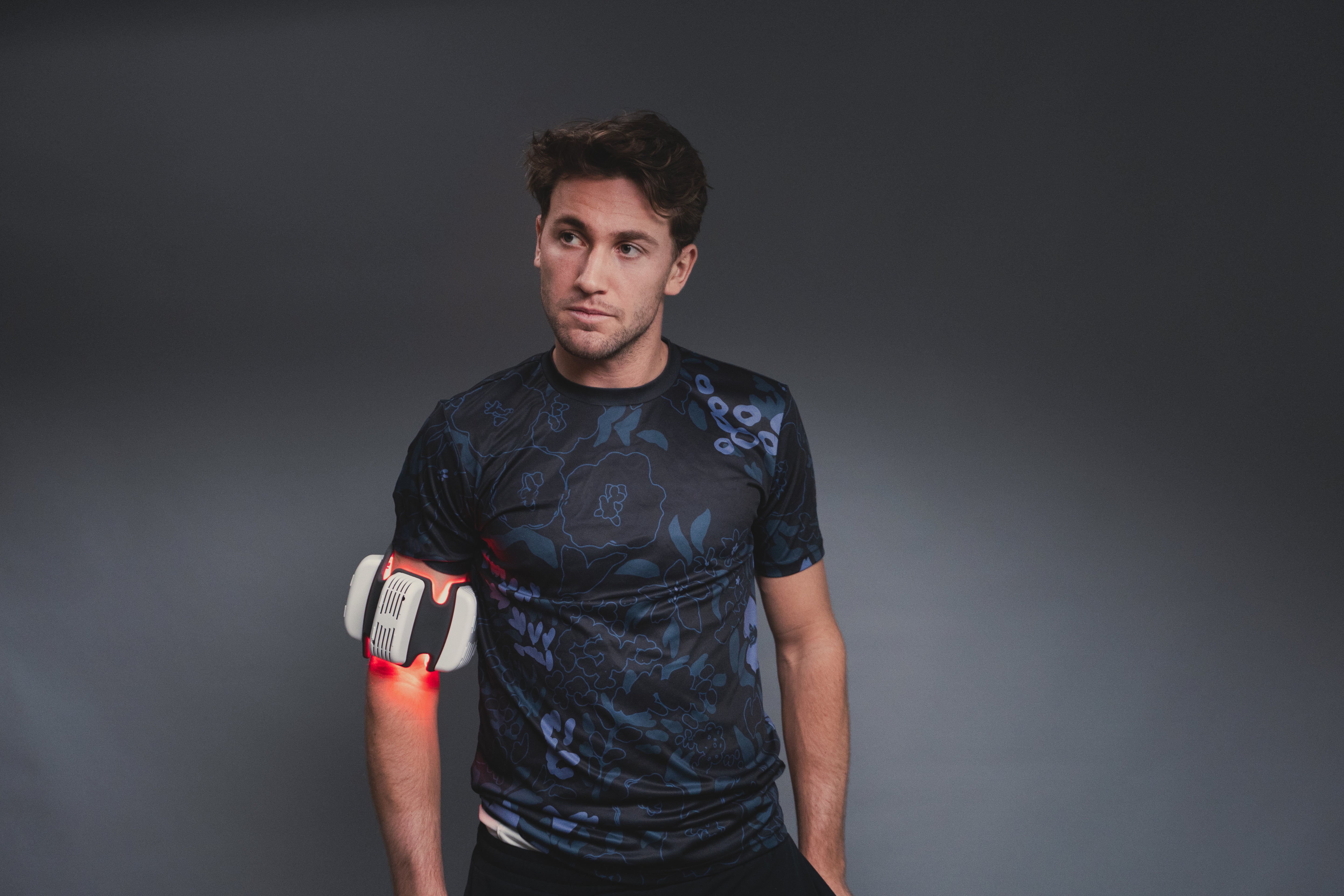 Man using FlexBeam for muscle recovery and pain relief